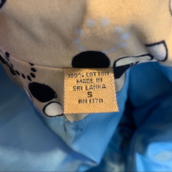 I.e. Tan trench coat with Mod circle design. - Picture 6 of 8